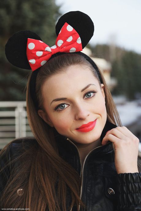 Hot redhead Giulia removes her jeans to get naked on her bed