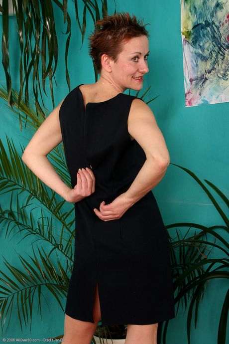 Mature brunette Georgina S shows her big ass and toys her pussy