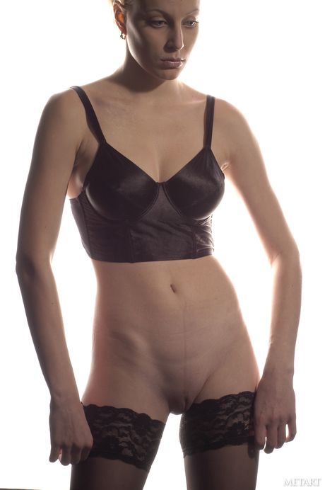 Russian venus Narkiss removes her lingerie and stockings to pose nude