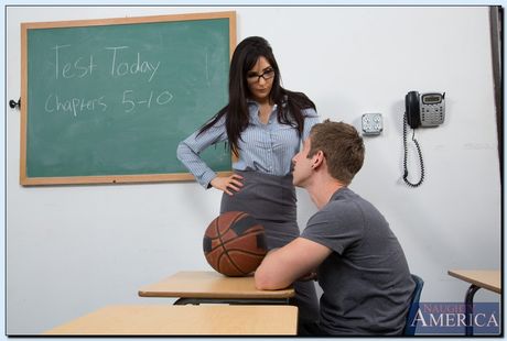 Hot teacher in stockings Diana Prince shows her big tits and poses