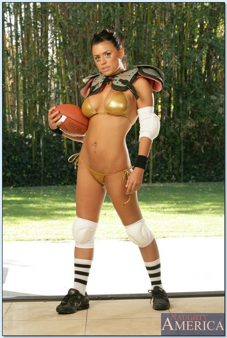 Brunette babe Eva Angelina strips and shows her tattooed body