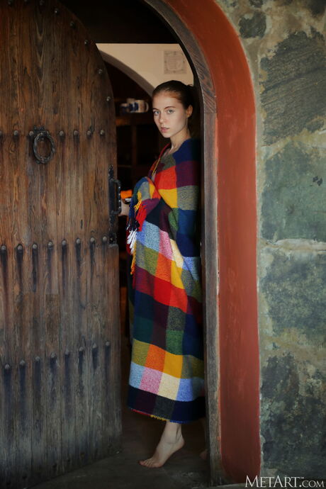 Delightful teen Shayla models totally naked in a garden with a view of the sea