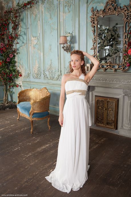 Young redhead Dennie bares herself on a patio chair