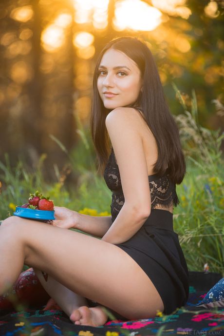 Winsome teen Cira Nerri takes off everything on a blanket in a backyard