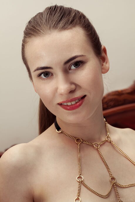 Ukrainian girl Alaine removes her lingerie and panties to get naked