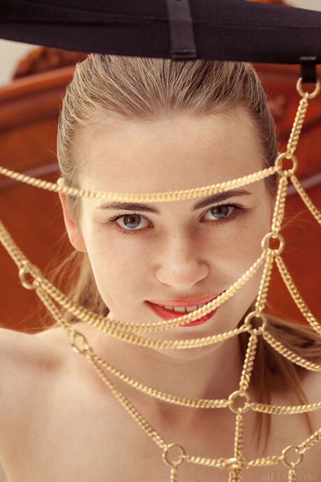 Ukrainian girl Alaine removes her lingerie and panties to get naked