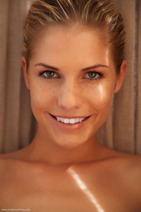 Blonde teen Iveta strikes great nude poses in a pair of heels