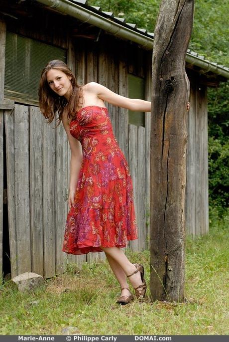 Lovely teen Marie Anne goes nude on a rocky outcrop