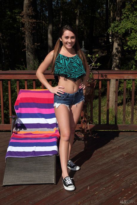 Lean teen with pigtails Mackenzie Mace toys her pussy outdoors