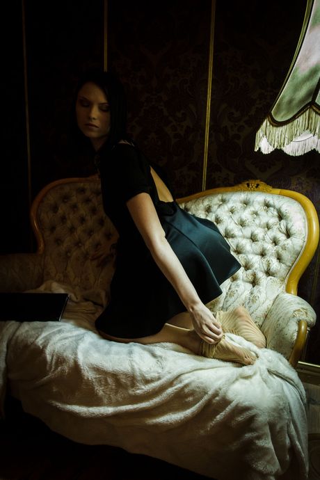 Brunette teen Frances Yean gets naked in a kitchen before fingering her pussy