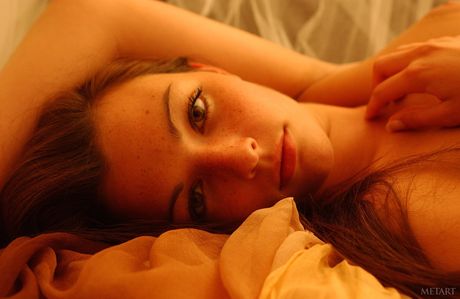 Cute teen Virginie gets naked without embarrassment during solo action