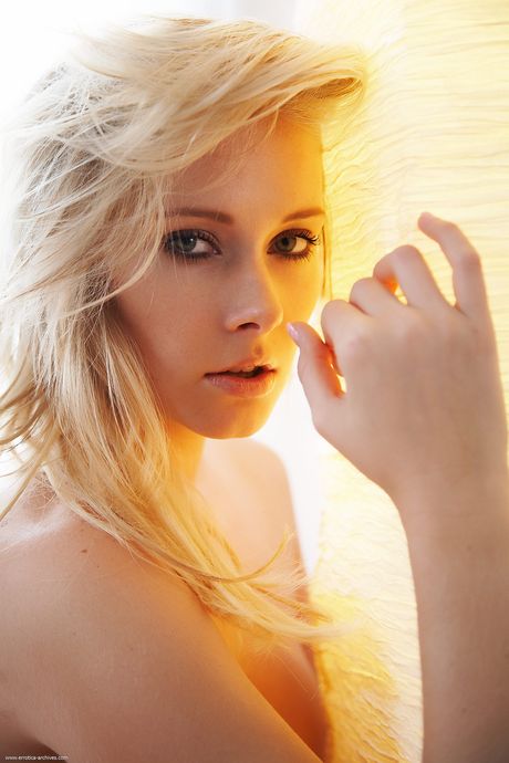 Lovely teen Deni strips off her black dress and poses nude in a solo