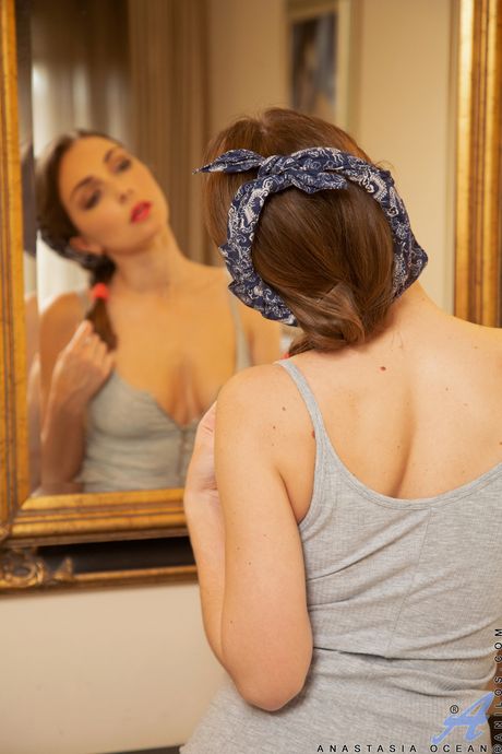 Blonde MILF Anastasia Ocean shows her big tits and shaved pussy in stockings