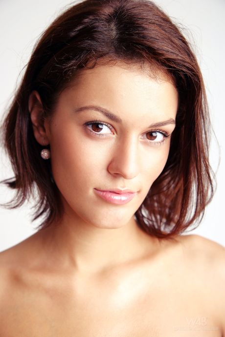 Glamorous brunette Becca toying her pussy with a dildo in high heels