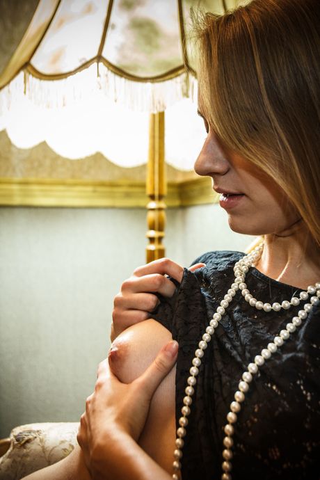 Delightful teen Izabella K fingers her pussy while naked on a piano bench