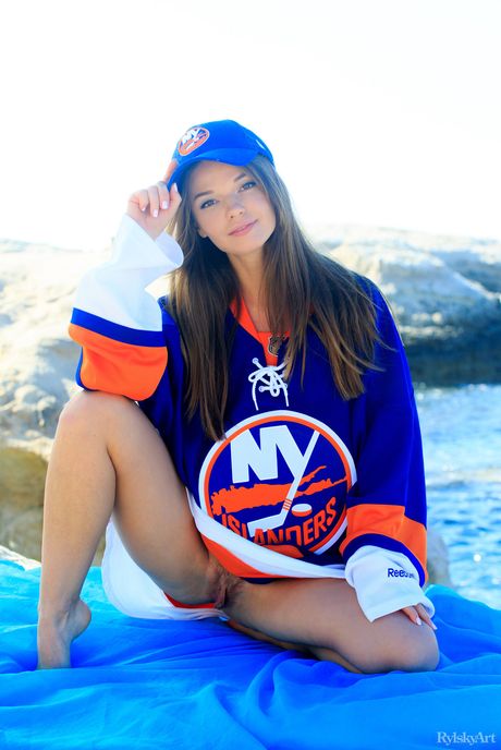 Slender teen Nedda strips and poses nude in the garden