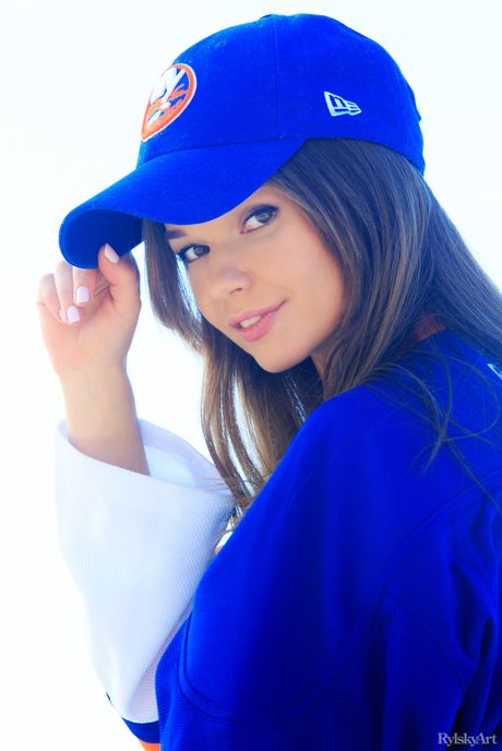 Slender teen Nedda strips and poses nude in the garden