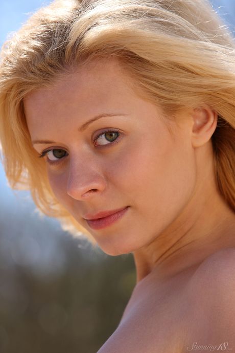 Blonde teen Oliwia A gets naked on a beach before having her pussy licked