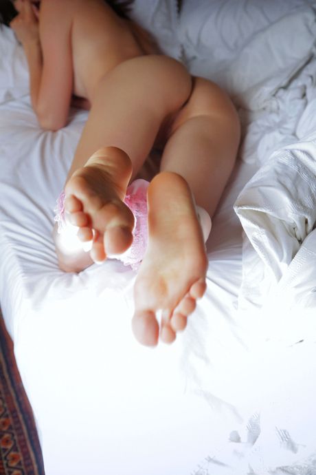 Angelic teen Adel Morel removes her bikini and panties to get bare naked