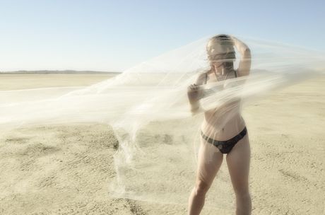 Natural redhead Melody Jordan gets naked on a balcony in high heels