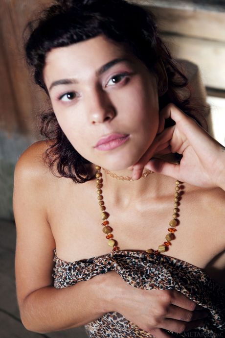 Alluring teen Callista B gets naked on a wooden floor in a shack