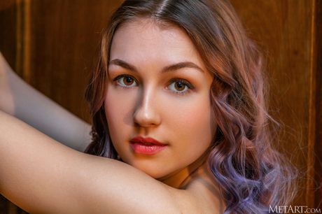 Ukrainian erotic model Isabele removes white stockings to get totally naked