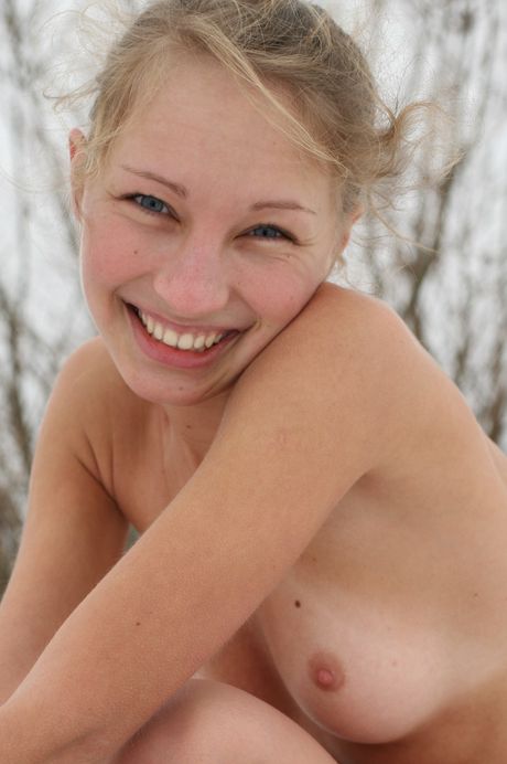 Blonde teen Mascha models naked in a pair of black boots