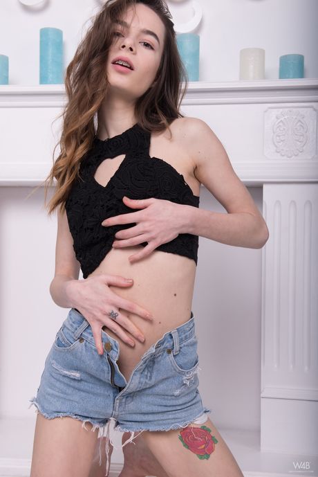 Cute teen Lucky shows her tight slit and ass in the nude on a bed