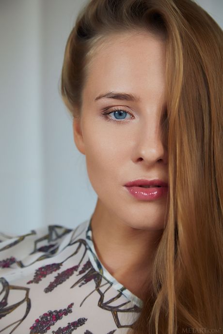 Sexy blonde Nimfa exhibits her big tits and bald pussy