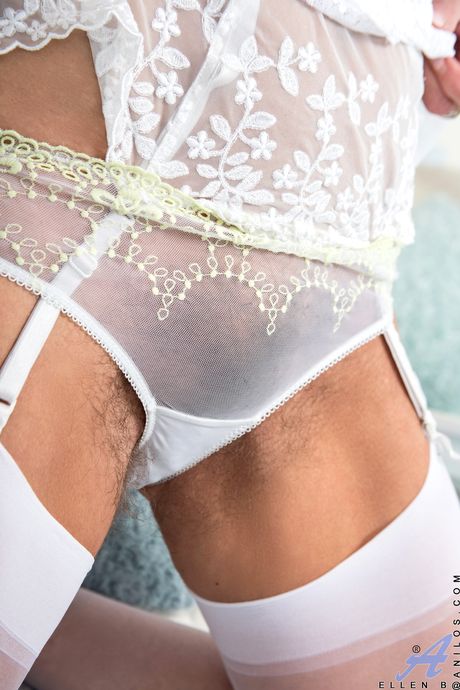 Mature blonde Ellen B. shows her hairy pussy in stockings and lingerie>