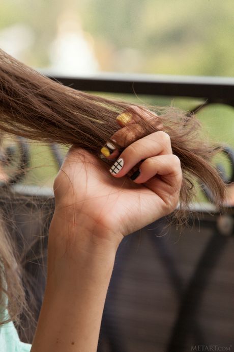 Alluring teen Muse removes her dress to model in the nude