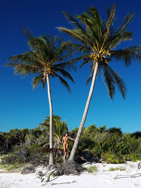 Naked teen Gabriela strikes great solo poses on a sandy beach