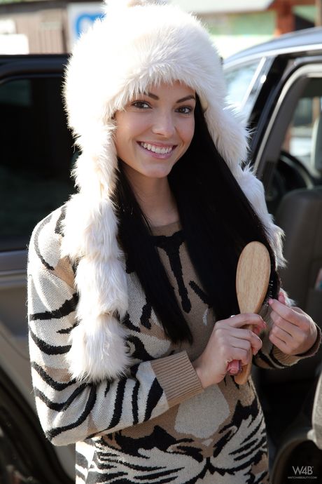 Cute teen Sapphira shows her tiny tits and bald pussy in the snow