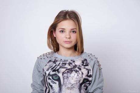 Thin teen Colleen A strips to her high heels and shows her tiny tits