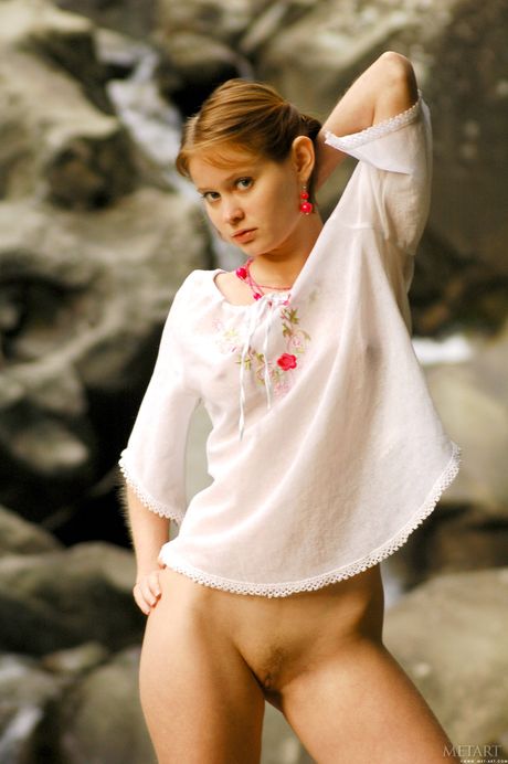 Sexy redhead Silvia B shows her tiny tits and bald pussy in public