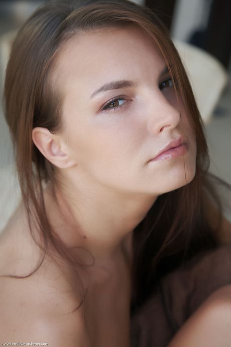 Lovely teen Carina highlights her beautiful body while completely naked