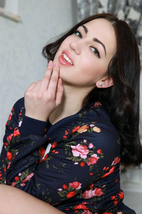 Svelte teen Sivilla exhibits her small tits and poses naked on a fur rug