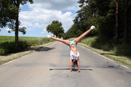 Flexible teen Sabrisse shows her tight butt and pussy in the nude outdoors