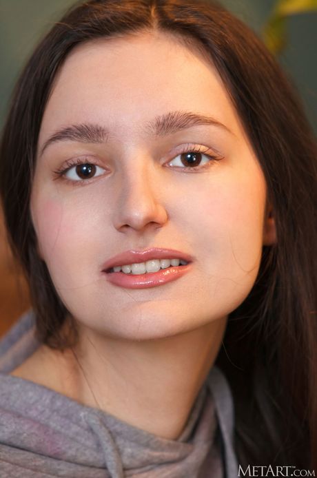 Adeline takes off her clothes and exposes her sexy body and hairy pussy