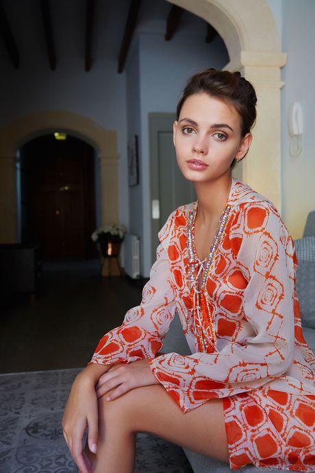 Thin teen Lilit A fingers her pussy after getting naked in high heels