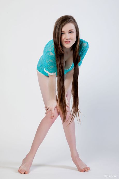 Brunette teen Emily Bloom spreads her legs wide open to show her bald pussy