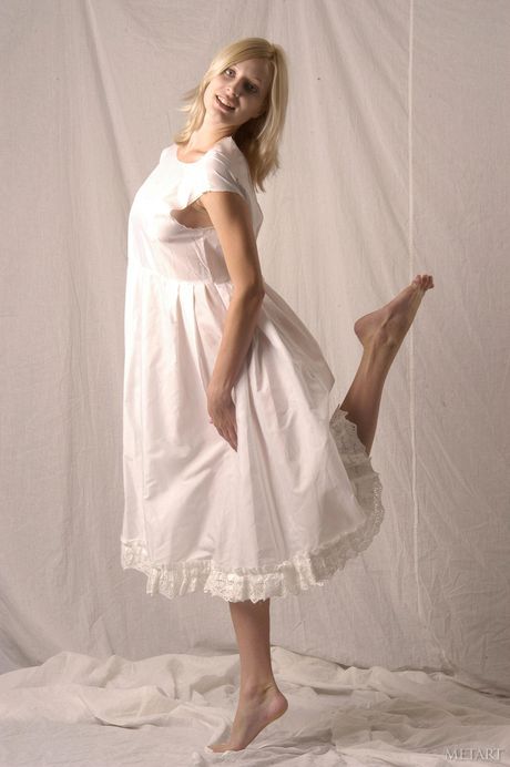 Blonde amateur Narkiss strips and poses naked in the kitchen