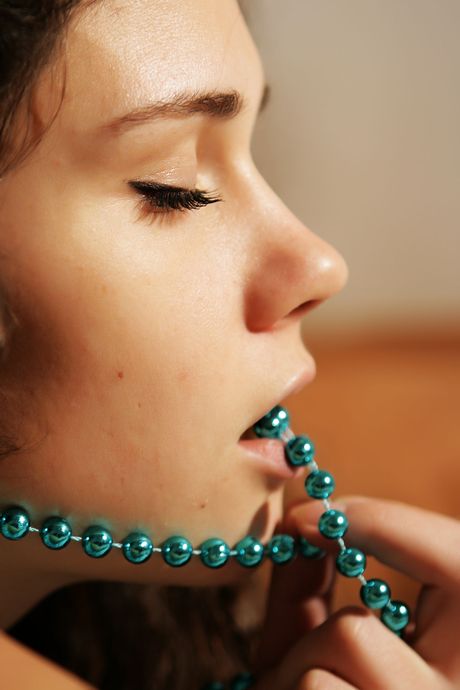 Busty teen Ira I removes a dress to get naked in a confident fashion