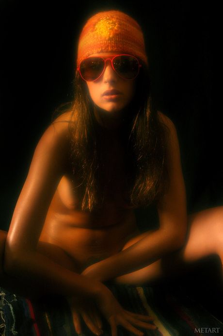 Ukrainian belle Vika AC removes her glasses and lingerie to pose nude