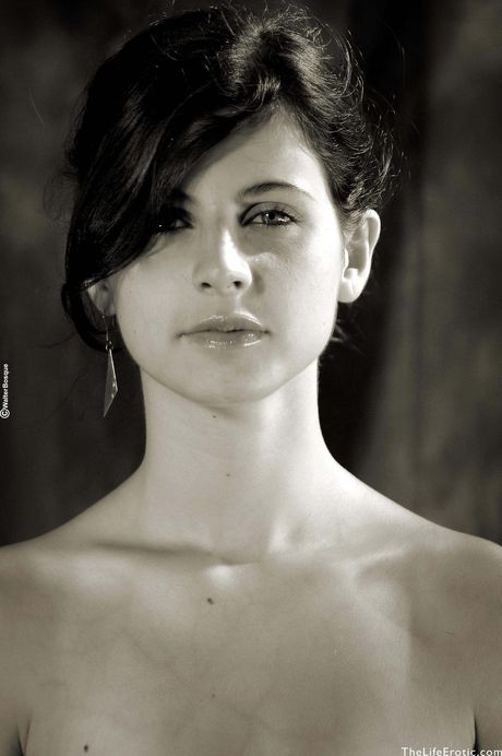 Skinny 18-year-old Muriel shows her tiny tits and hairy pussy in a solo