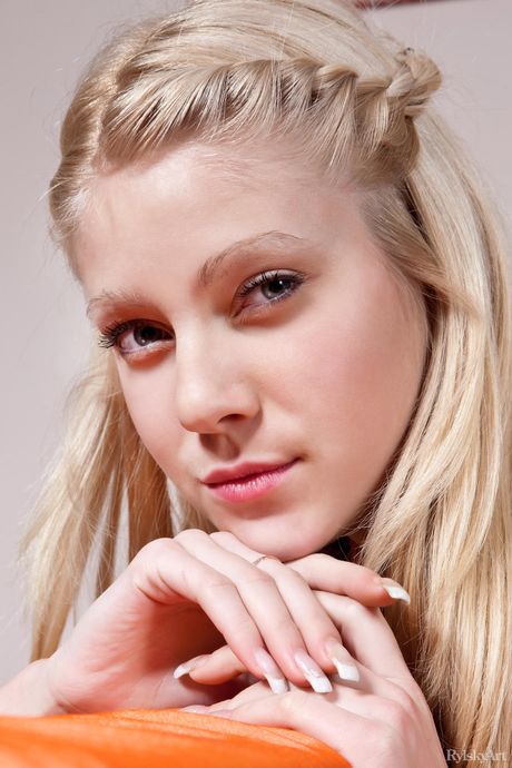 Naked teen Bayle spreads her legs wide open to show her hairy pussy