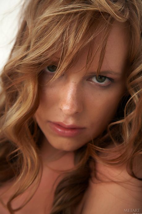 Redheaded babe Monika A flaunting big natural tits and sexy ass in heels