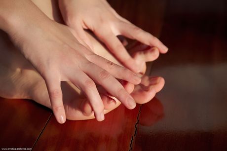 Brunette teen Lorena models totally naked on her bed fearlessly