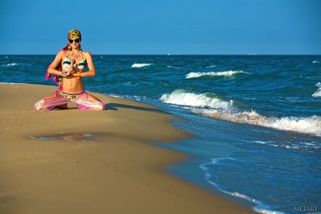 Ukrainian babe Karoline A strips and poses naked on the beach