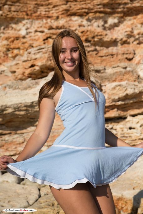 Lean teen Alya shows her small tits and bares all in a solo